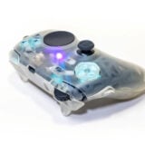 A DIY controller with a touchpad and mousewheel sits on a white backdrop.